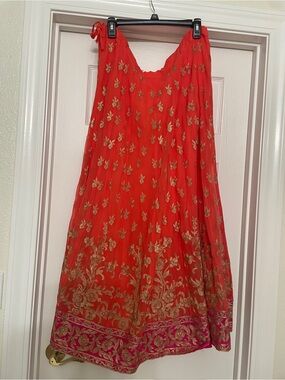 Orange and dark pink long skirt or lengha